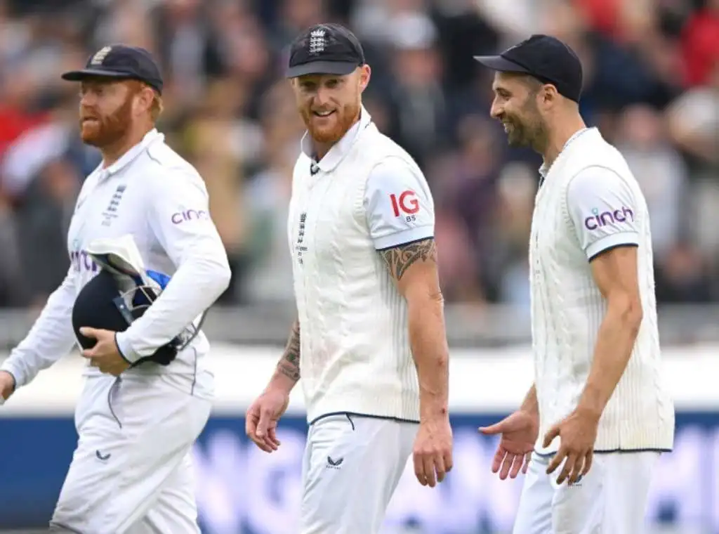 Ben Stokes speaks to Mark Wood as they leave the field at tea time during day four of the Ashes 4th Test Match between England and Australia at Emirates Old Trafford on July 22, 2023